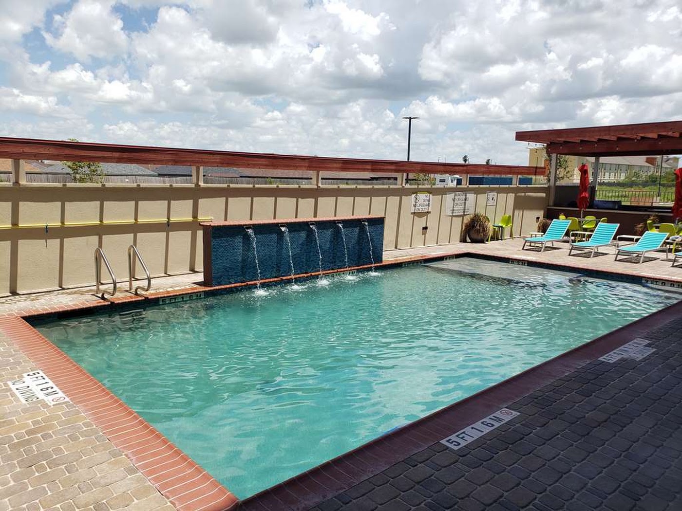 Outdoor pool at Home2 Suites by Hilton Edinburg
