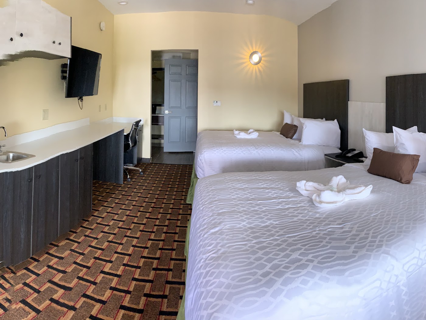 Guest room with kitchenette at HomeStay Inn & Suites Edinburg