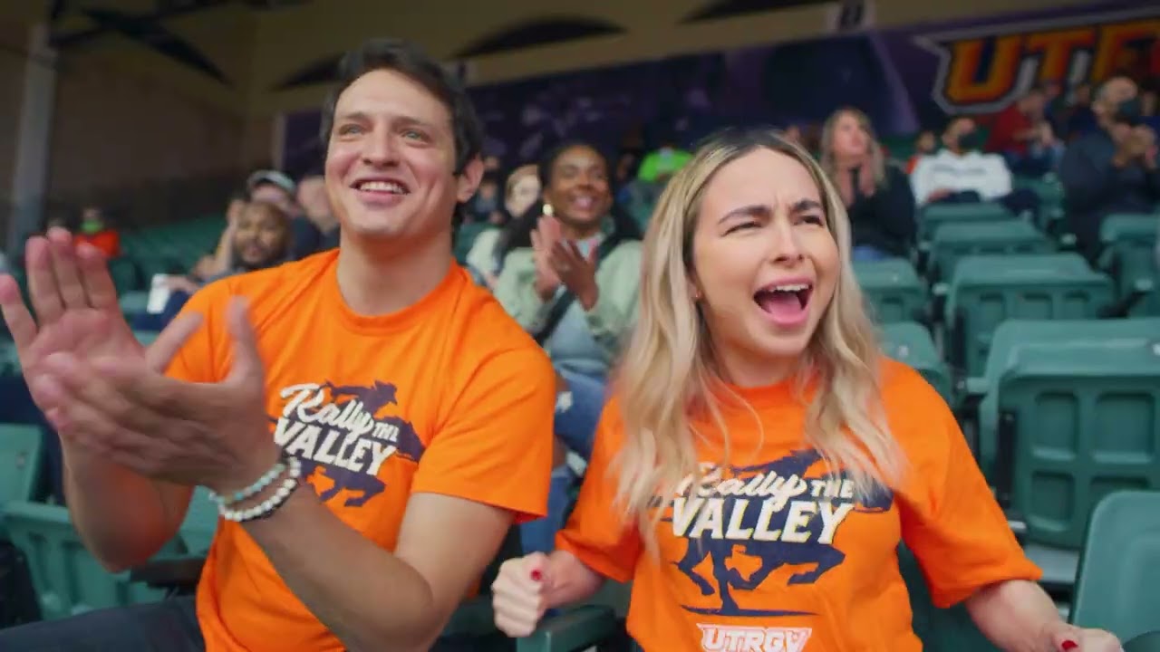 Fans cheering together at an Edinburg sporting event